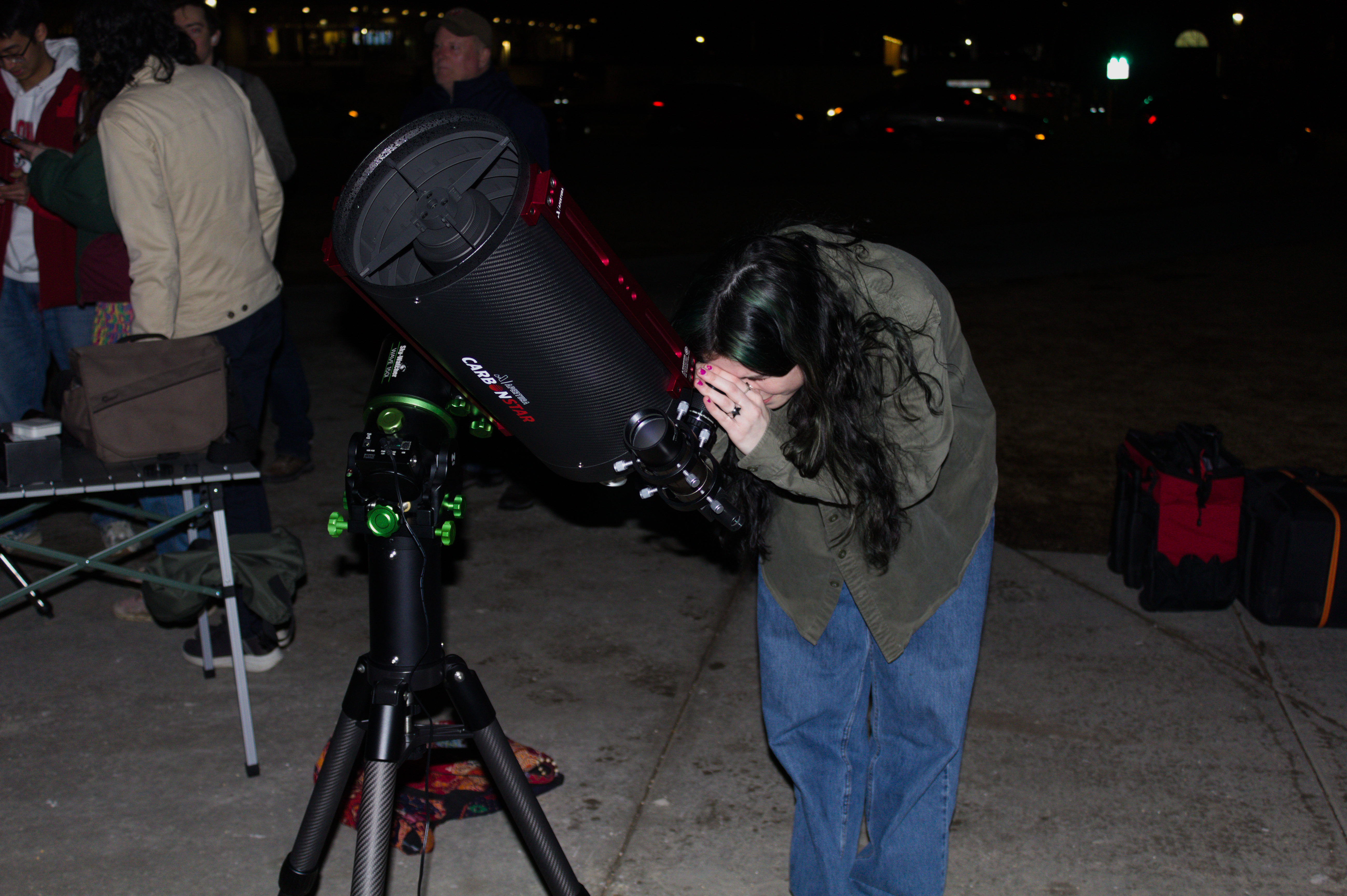 Sidewalk astronomy in Madison - student views the Orion Nebula.png