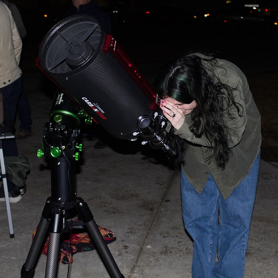Sidewalk astronomy in Madison - student views the Orion Nebula (crop).jpg